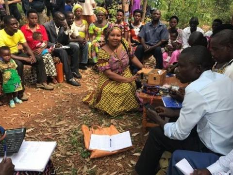 Women and men saving together in Rwanda. Angeline Munzara/World Vision